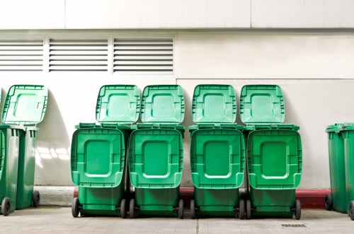 Front view of a commercial waste crew in Neasden preparing for collection