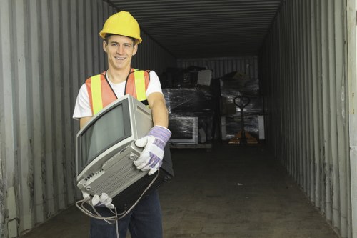 Staff member assisting a business client with waste collection options